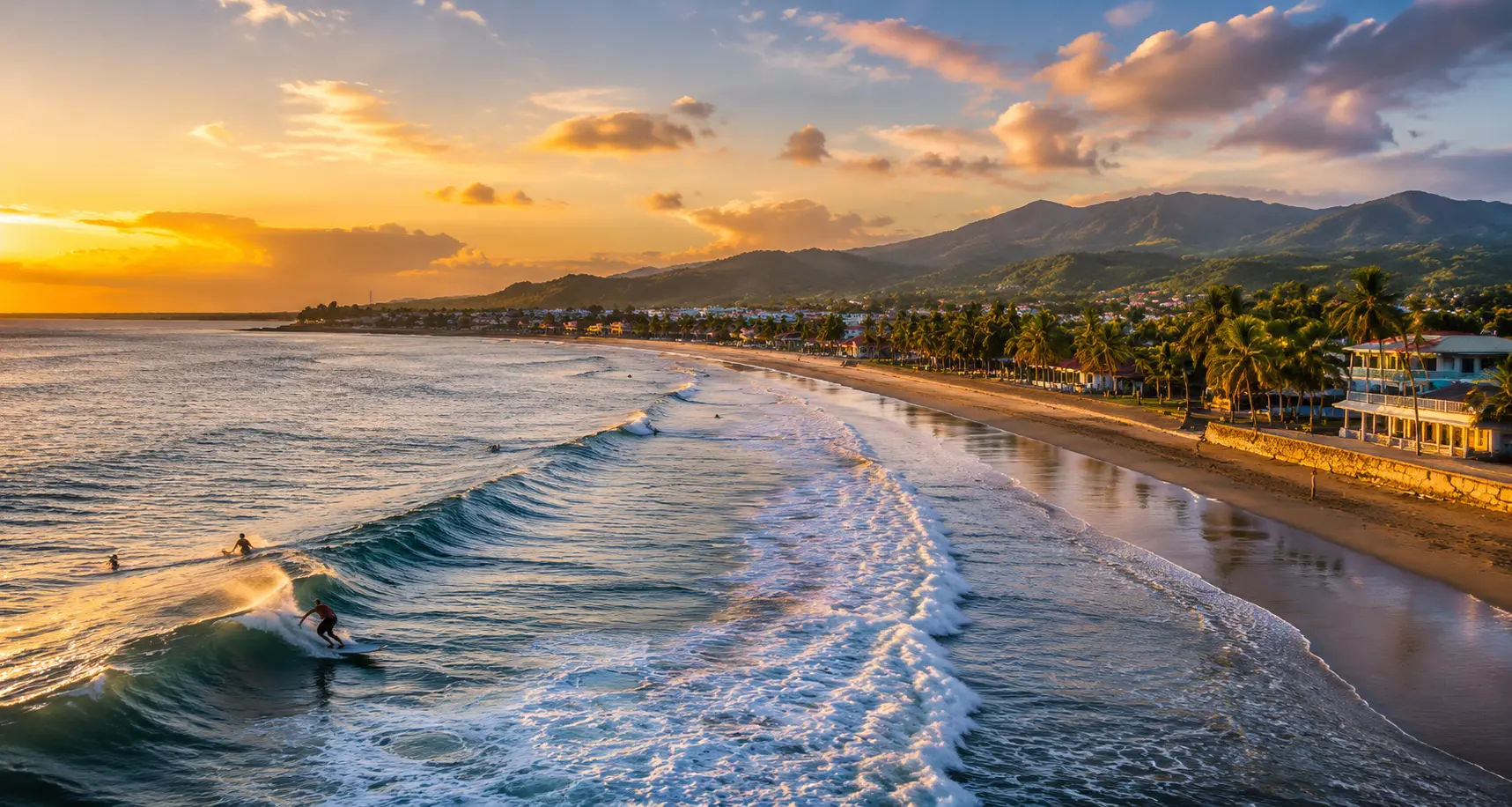 Golden hour view of Gubat, Sorsogon featuring surfers, sandy beach, and the coastal town along the Pacific Ocean.