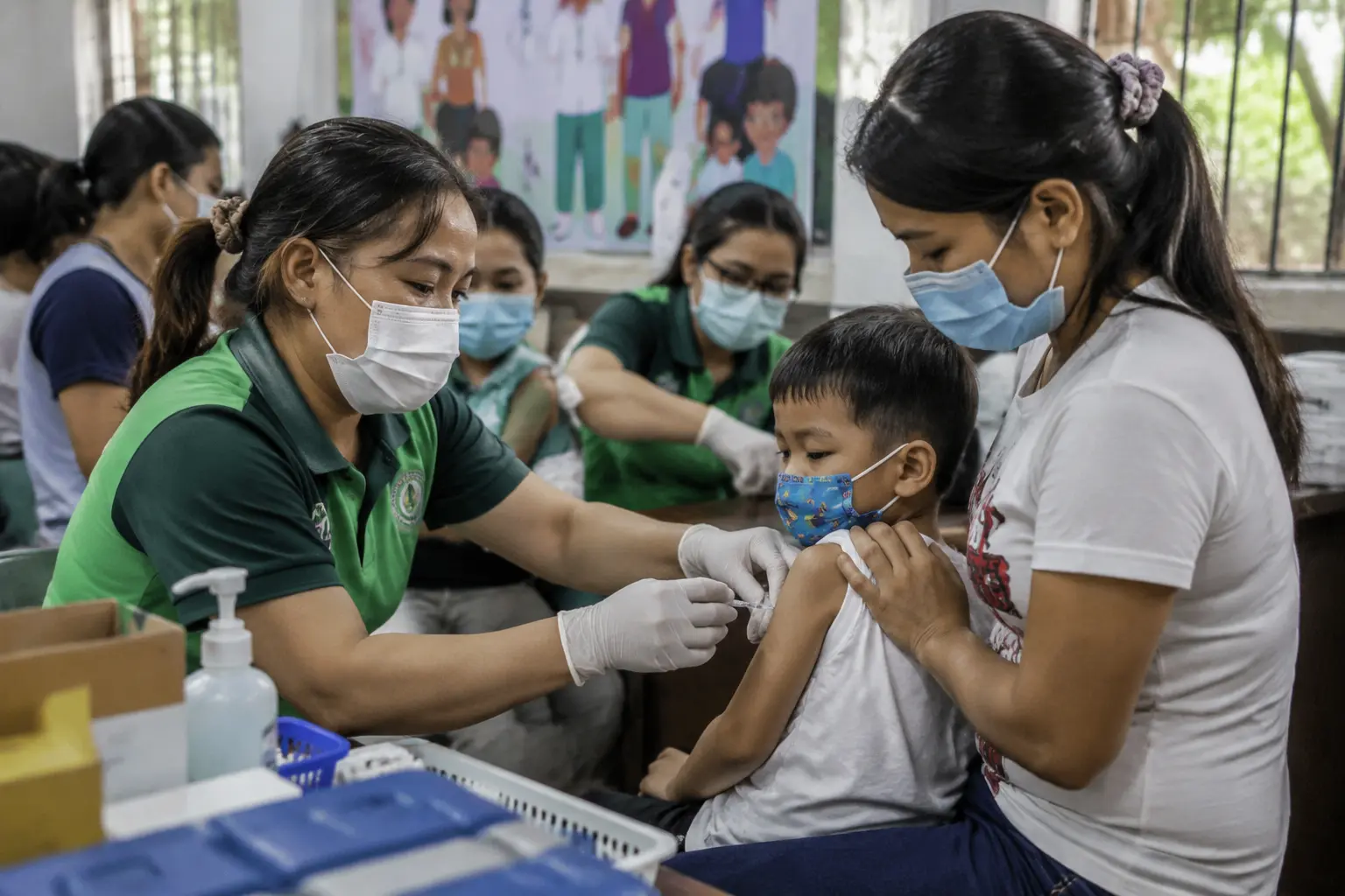 DOH Bicol healthcare workers administer measles-rubella vaccines to children during the Ligtas Tigdas vaccination campaign in Sorsogon City.